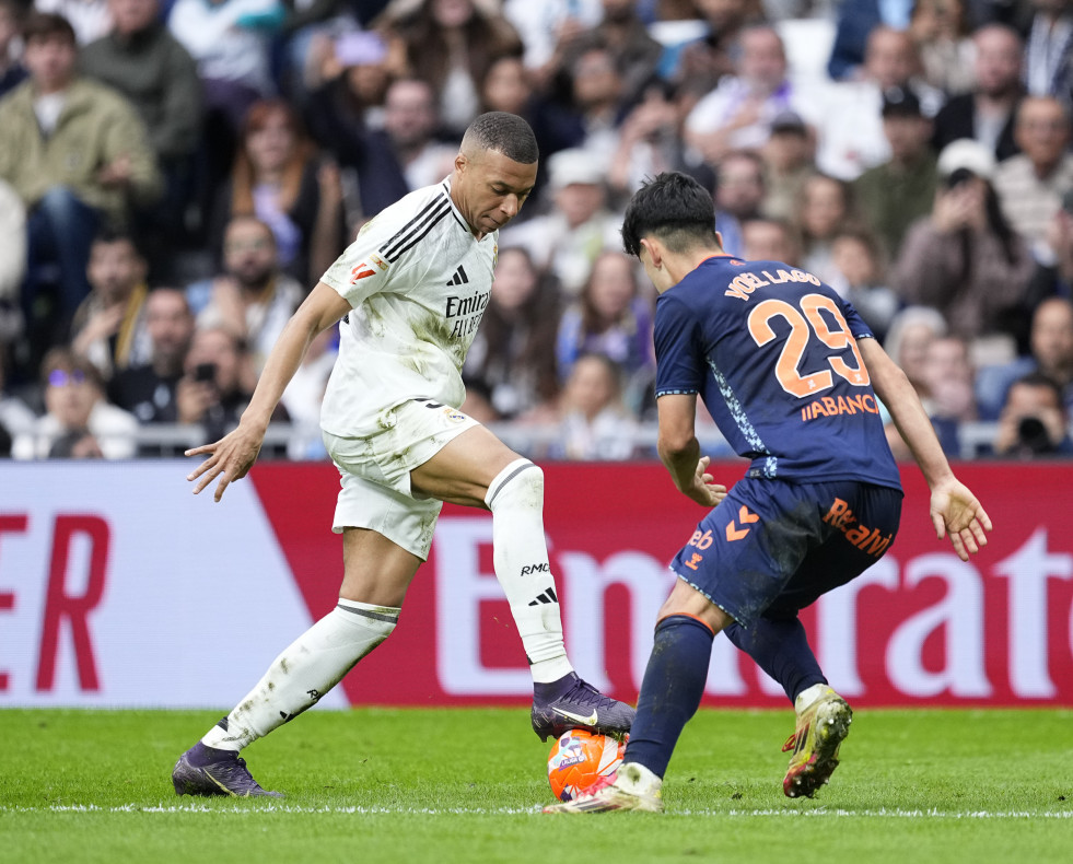 Kylian Mbappe of Real Madrid and Yoel Lago of Celta